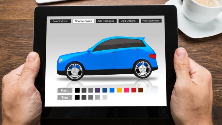 A person using a tablet to buy a car online
